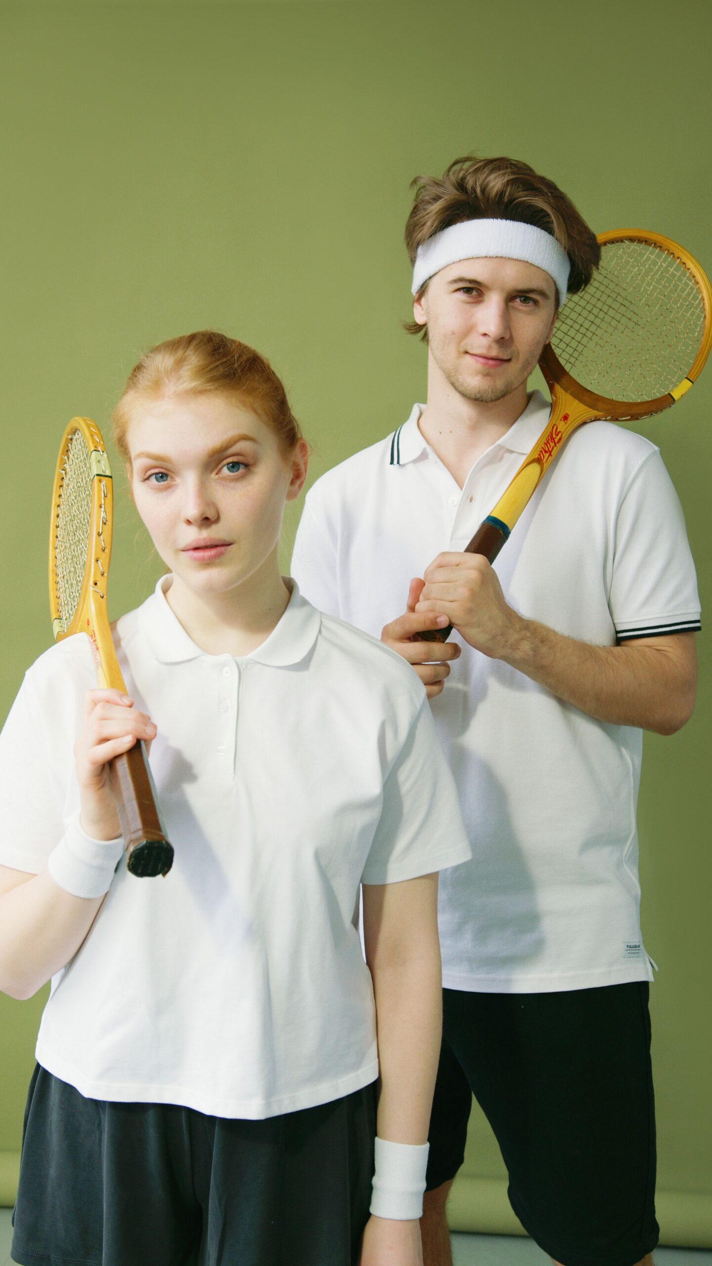 Men and women wearing premium performance activewear, including leggings, tank tops, fitness shirts, gym hoodies, and active wear sets during various gym workouts.