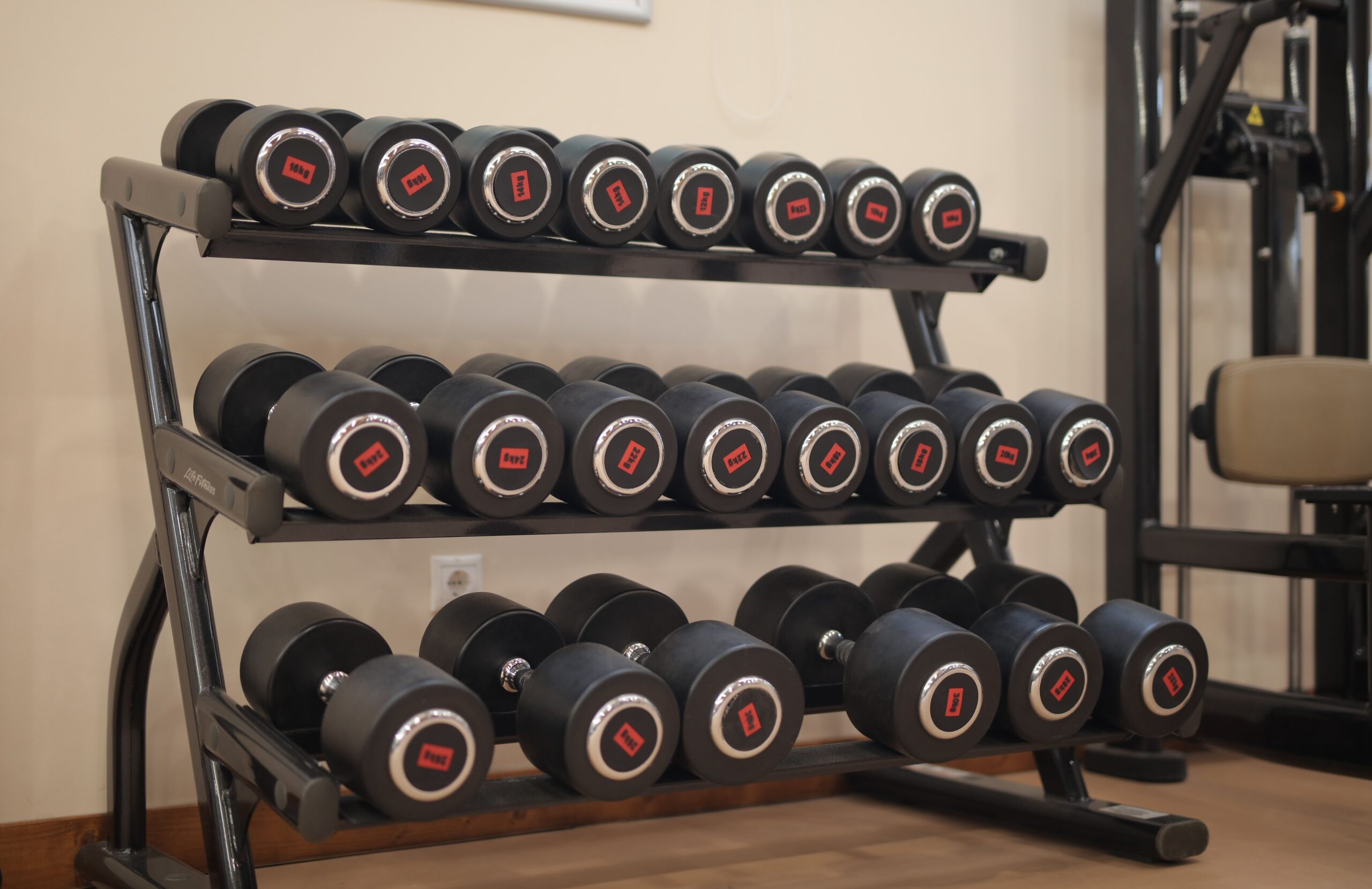 Home workout wardrobe featuring leggings, tank tops, fitness shirts, gym hoodies, and activewear arranged for indoor fitness training.